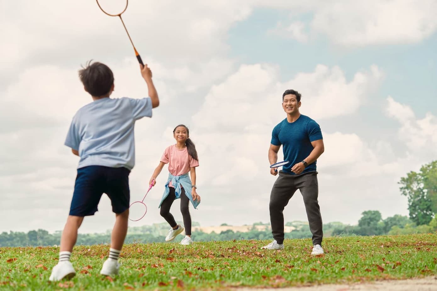 family playing tennis during Olympic advertisement