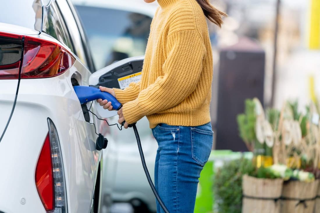 woman with electric car