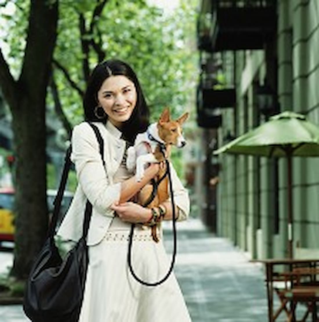 Woman carrying pet to vet